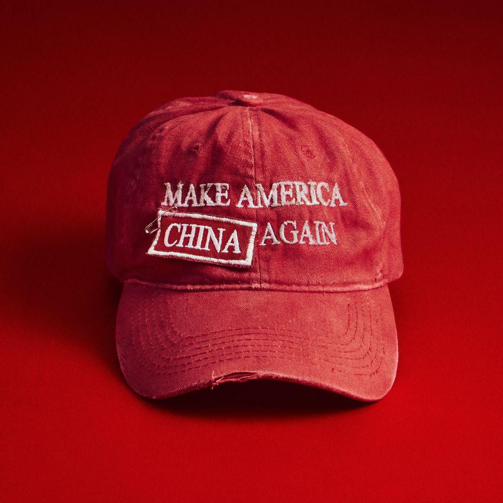Red baseball cap that says 'Make America China Again'