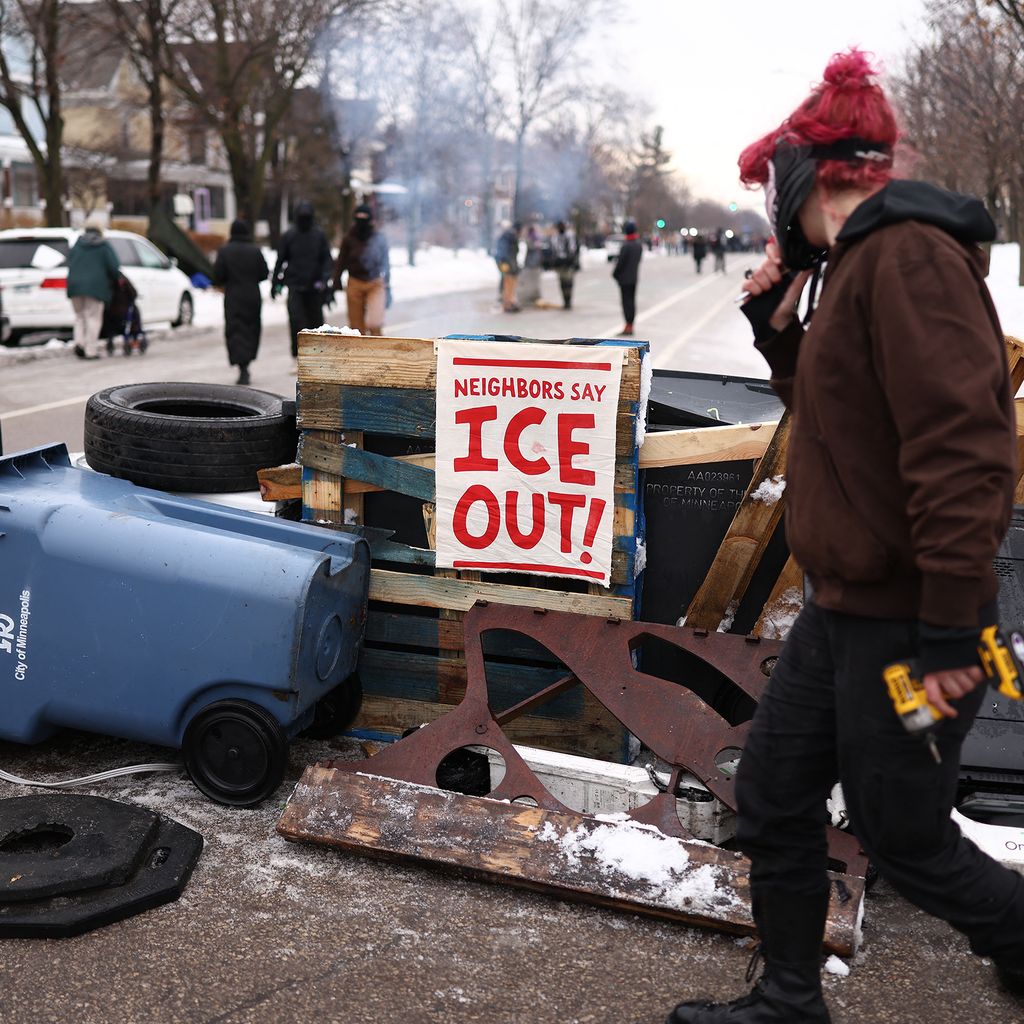 Demonstrators gather at the street where 37yearold Renee Nicole Good was shot and killed at point blank range on January...