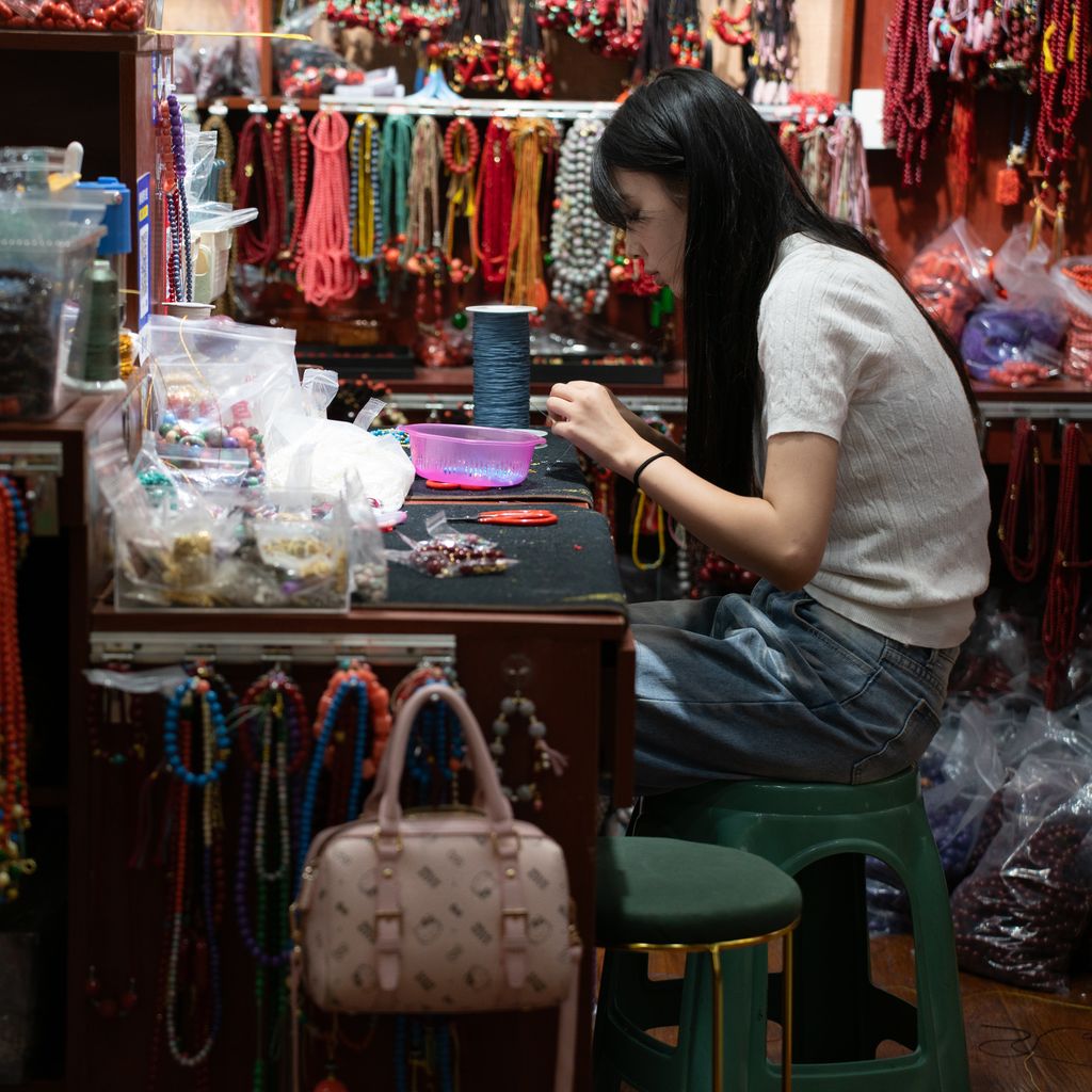 Vendor making jewelry