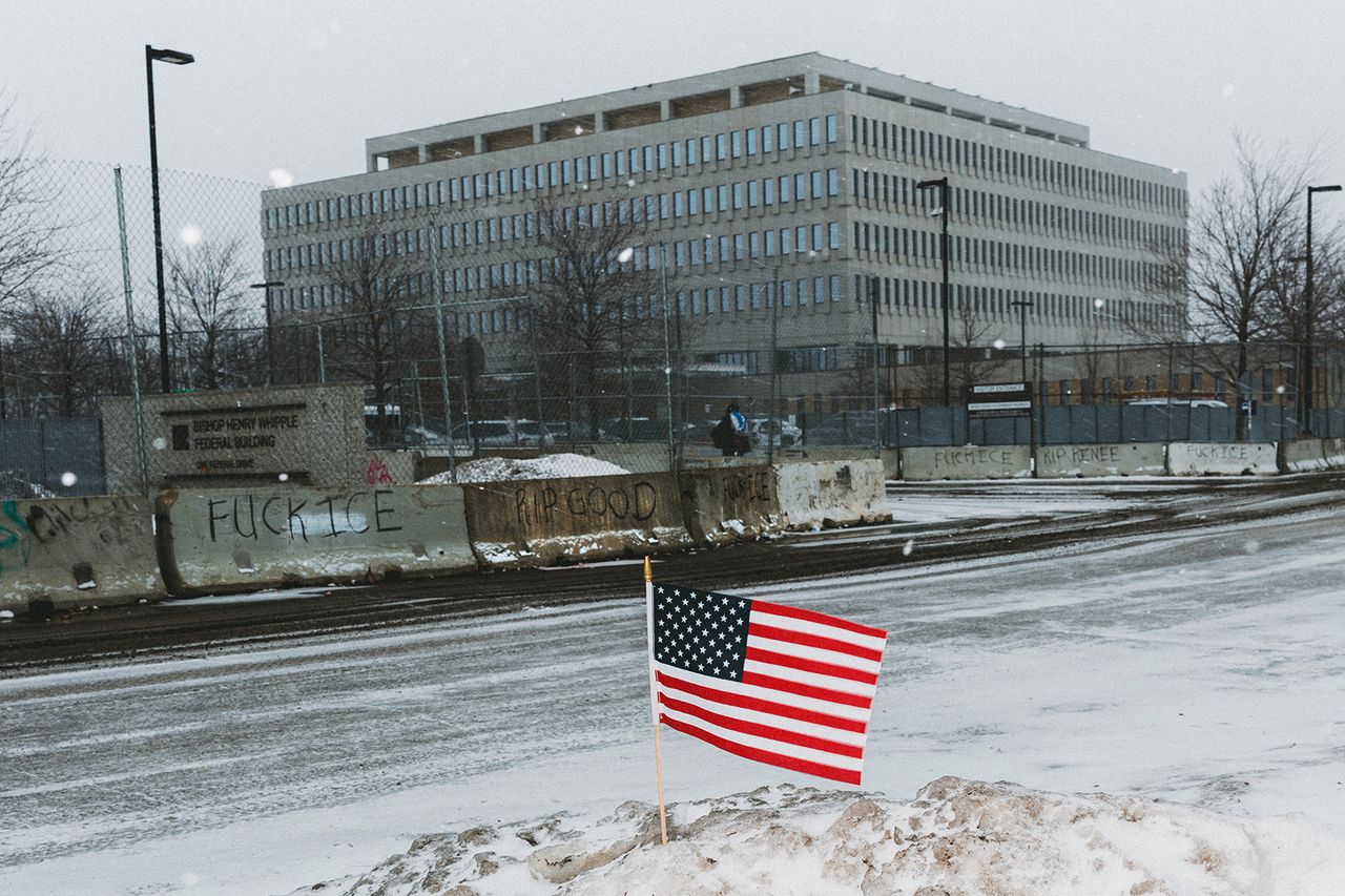 Image may contain Architecture Building Office Building Flag American Flag City and Winter